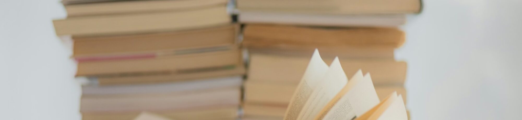 white book on brown wooden table